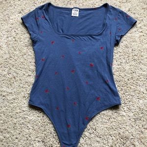 Cherry Print Somber Blue short sleeve thong bodysuit by PINK in size medium.